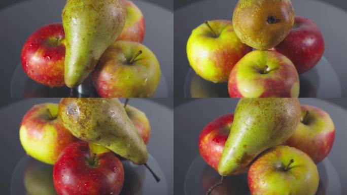 旋转红苹果和梨的特写镜头。健康理念。