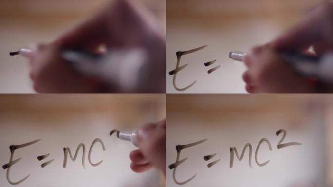 用干擦标记写在透明有机玻璃上的 “E = mc2”