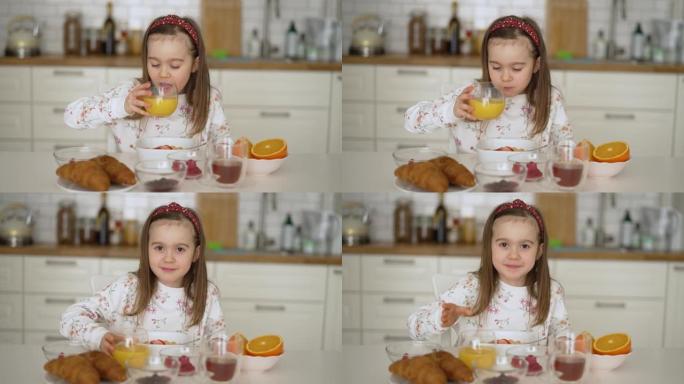 早餐时喝橙汁的健康孩子