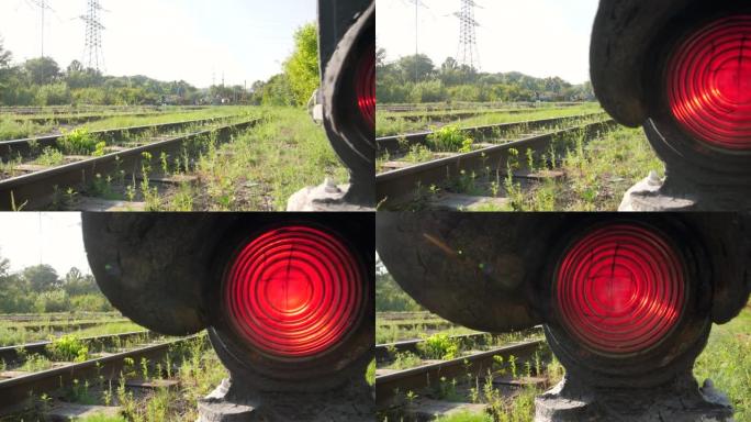 4k dolly在铁路货站上的旧信号量发光红灯的视频