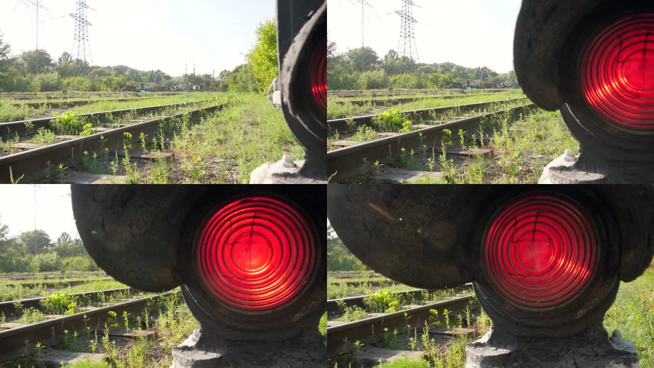 4k dolly在铁路货站上的旧信号量发光红灯的视频
