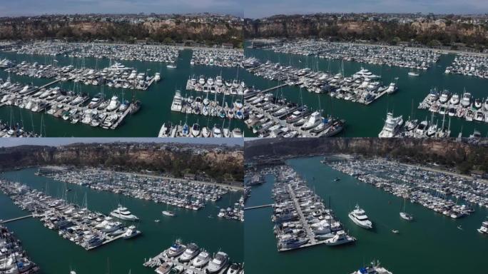 达纳角码头的大型超级游艇交通在加州港口航行-概览镜头