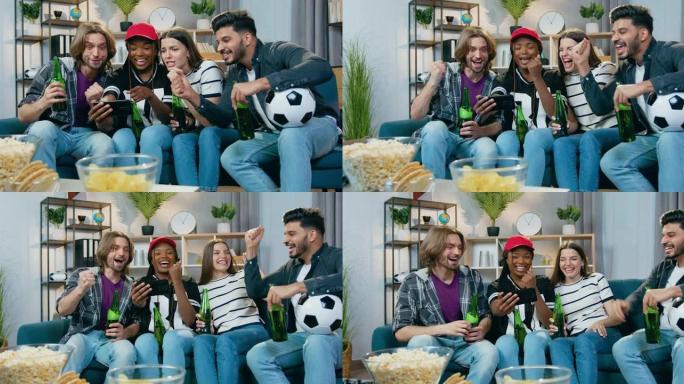 情绪高涨的年轻多种族朋友在智能手机上观看体育比赛，并举手庆祝最喜欢的球队的胜利
