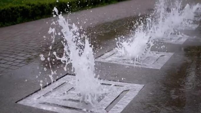 公园里的城市喷泉。水流起伏