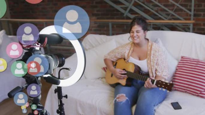 女性视频记录器上的人物图标在家里播放吉他录制视频日志