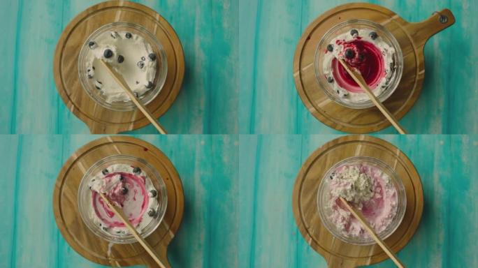 4k酸奶自制过程。制作新鲜的草莓和蓝莓甜点。滚动木板。延时拍摄。准备早餐。混合乳制品。用相机镜头移动
