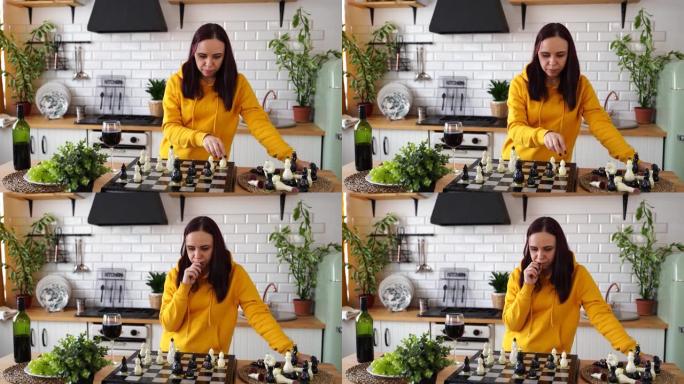 年轻女子在厨房桌子上下棋。女性在厨房里玩逻辑棋盘游戏