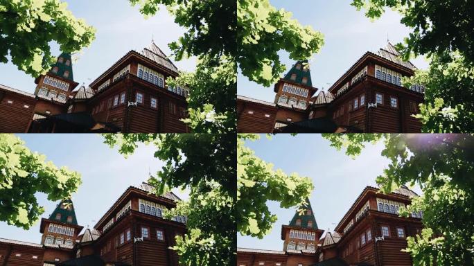 美丽的树枝后面是一座用木头建造的基督教寺庙。一座非常美丽的宗教建筑