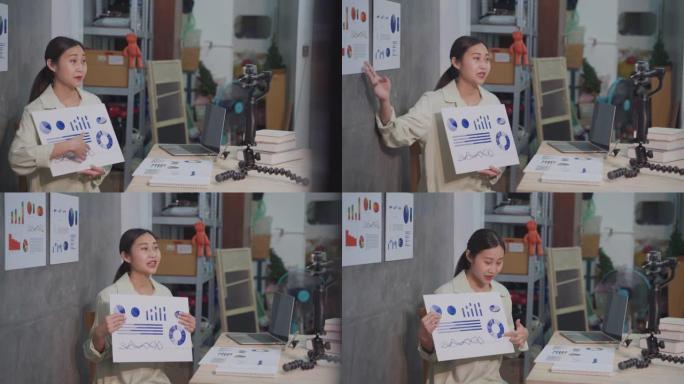 亚洲女教师使用图形和数据教学理财规划师手机视频聊天
