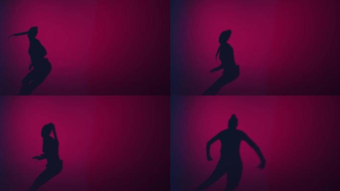 年轻女孩的影子在粉红色的工作室灯光下跳舞创意激情火热的舞蹈。表情和节奏。复制空间