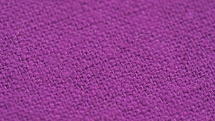 纺织背景-100% 紫色棉织物。微距拍摄