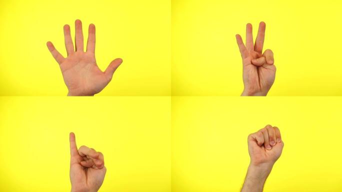 倒计时。手指从五到一的人的手，孤立在黄色的工作室背景上