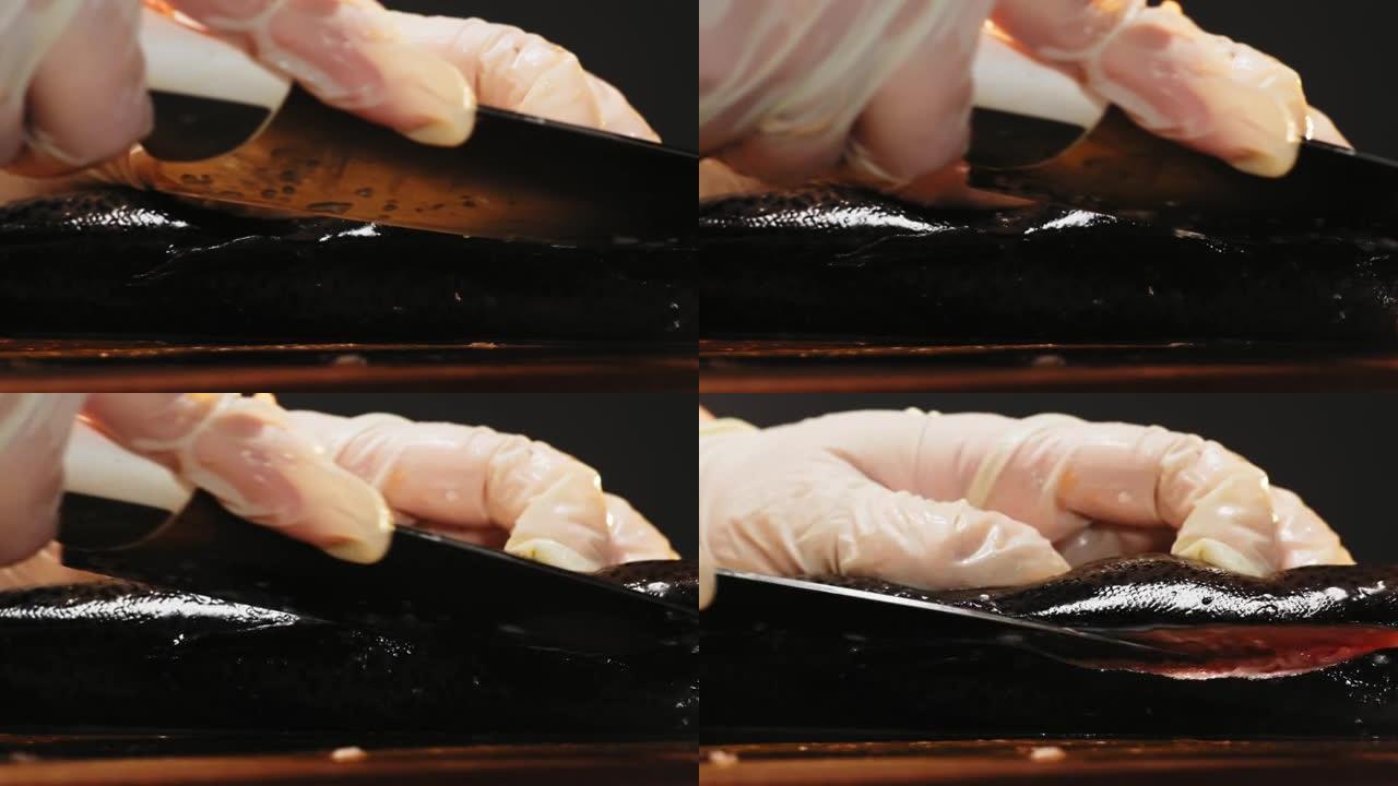 戴着手套的女人减少了船上美味的生红鱼