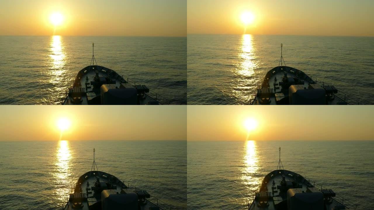 军舰上的日落穿透黄昏金色海面