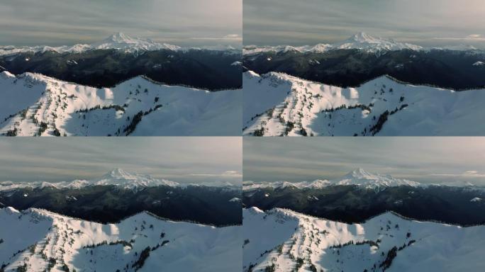 白雪皑皑的华盛顿山脉贝克峰的直升机透视