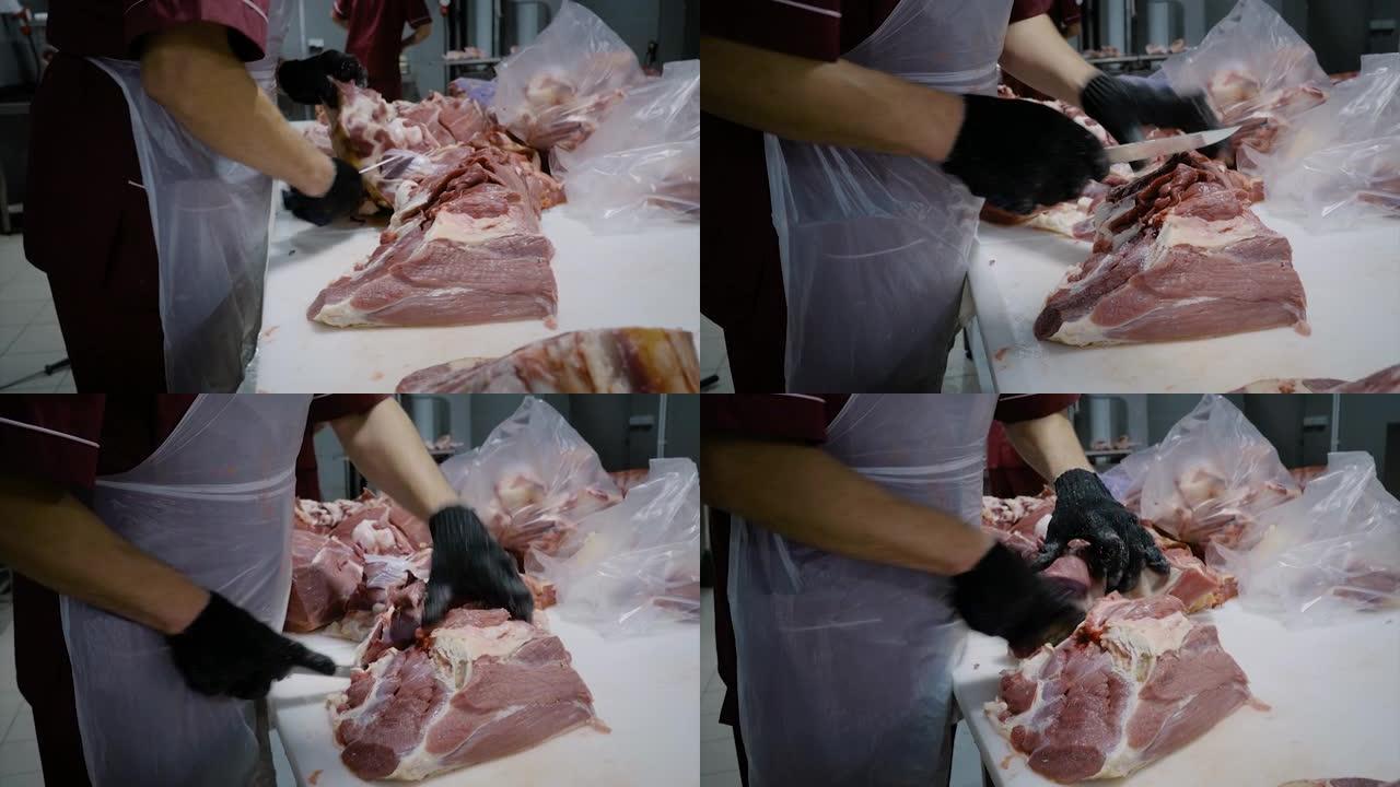 屠夫用刀割肉。切掉肉块。肉制品的生产。