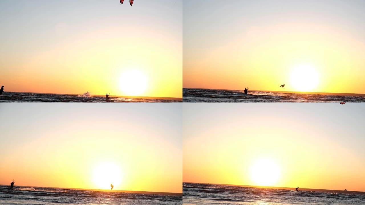 风筝冲浪者在夏天的日落下在水上飞行时做了一个技巧，慢动作