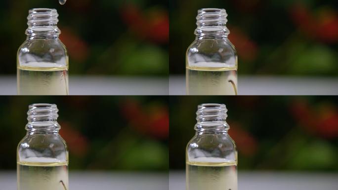有机种子油从移液器滴入罐子。