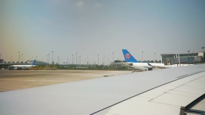 阳光明媚的日子广州市机场窗口全景4k中国