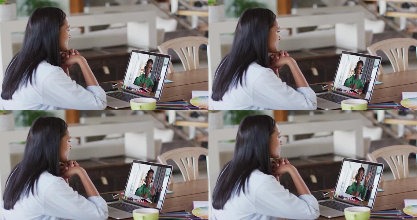 非裔美国女教师在家里的笔记本电脑上与非裔美国男孩进行视频通话