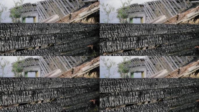浅景深 (选择性聚焦) 细节，用烧掉的房子烧掉的木头。