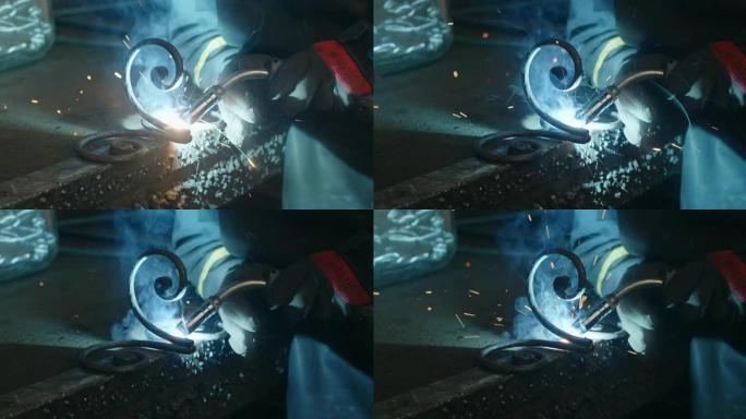 焊工在4k 60p Prores总部铁匠车间焊接安全制服、焊接和金属制品中的钢装饰细节