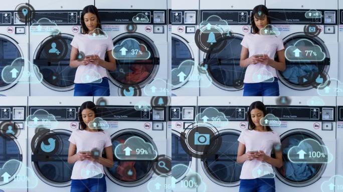 云上传图标漂浮在自助洗衣店使用智能手机的非洲裔美国女性