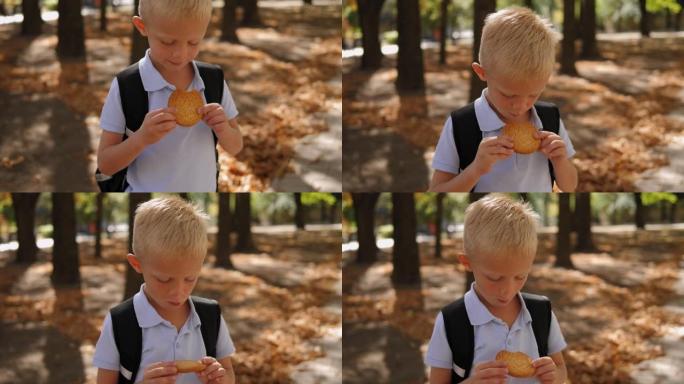 一个背着背包的男生的肖像，一个放学后吃饼干的男孩。