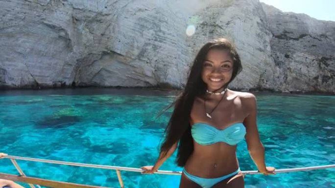 4k视频，亚洲妇女在希腊扎金索斯的船上享受暑假