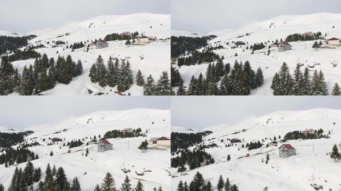马其顿滑雪胜地Popova Shapka村白雪覆盖的山和松树的惊人鸟瞰图