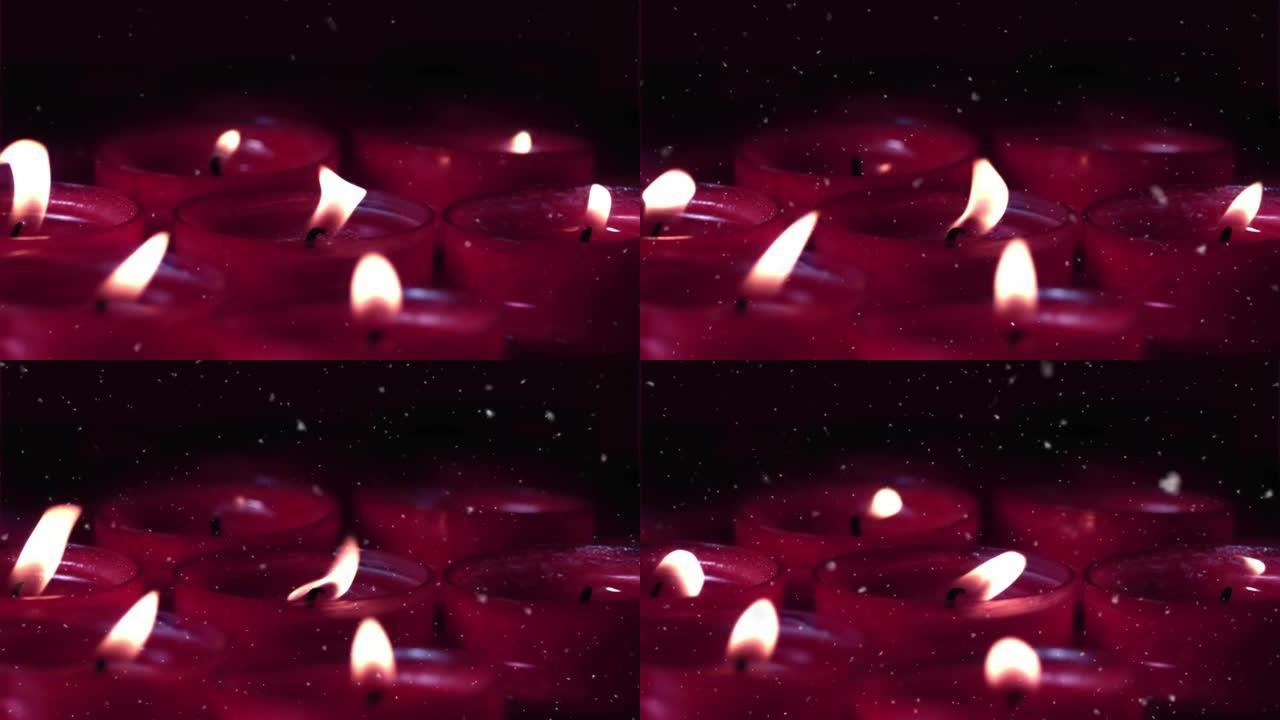 白色粒子落在点燃的红色蜡烛上的动画
