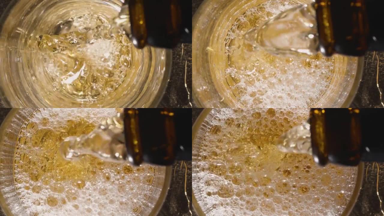 将啤酒倒入玻璃杯中。从上方观看。将一股啤酒倒入玻璃杯中，用泡沫覆盖底部，并将水平升高到玻璃杯的顶部。