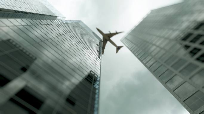 飞机飞过现代城市高楼