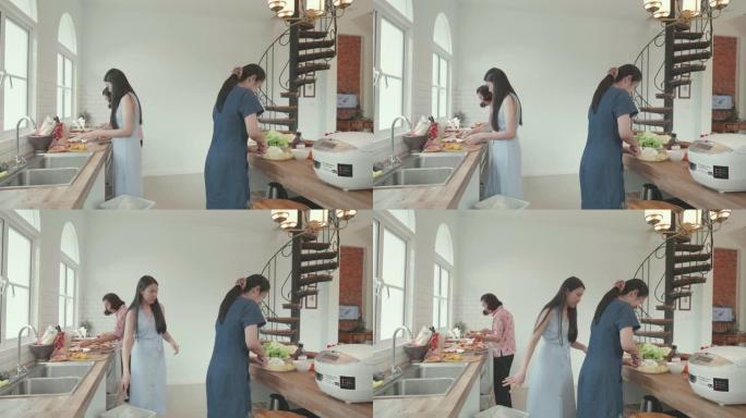 泰国家庭在家庭厨房准备晚餐的食物