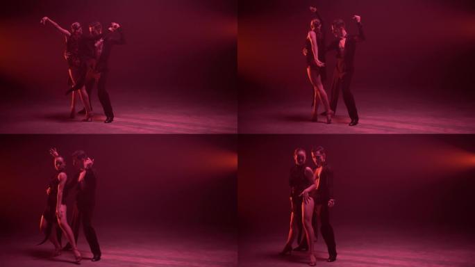 全长专业情侣在室内跳舞。舞者在感官上移动。