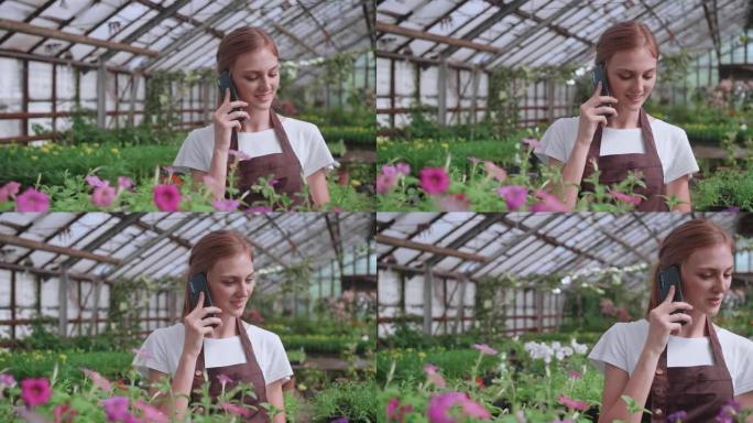 美丽快乐的女花店店长与客户在手机上谈论植物的特写肖像。白人妇女在自己的花店工作，并在智能手机上讲话。