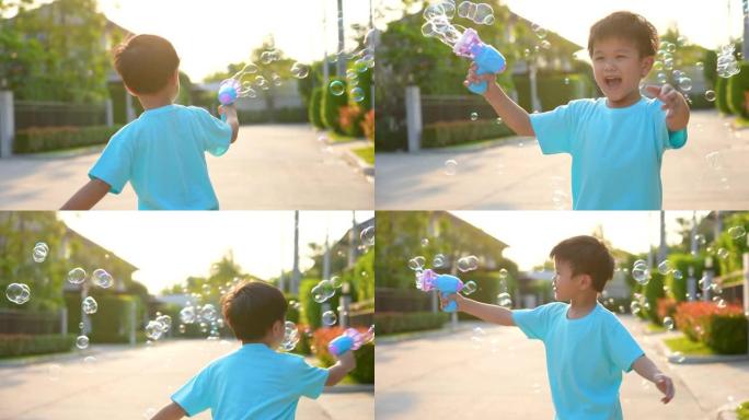 亚洲孩子在公园玩泡泡。幸福与夏天的概念