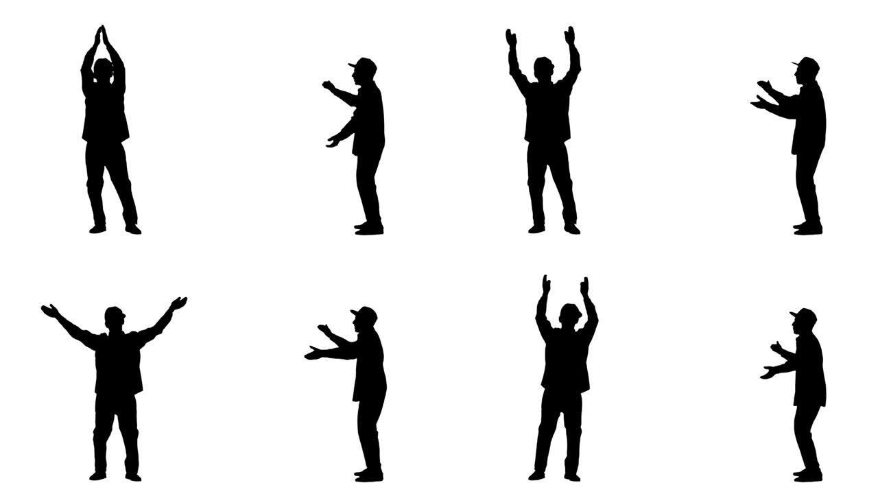 一个穿着年轻时尚衣服和帽子的年轻人的黑色剪影跳舞并拍手。白色背景上的2合1拼贴正面和侧面视图全长。慢