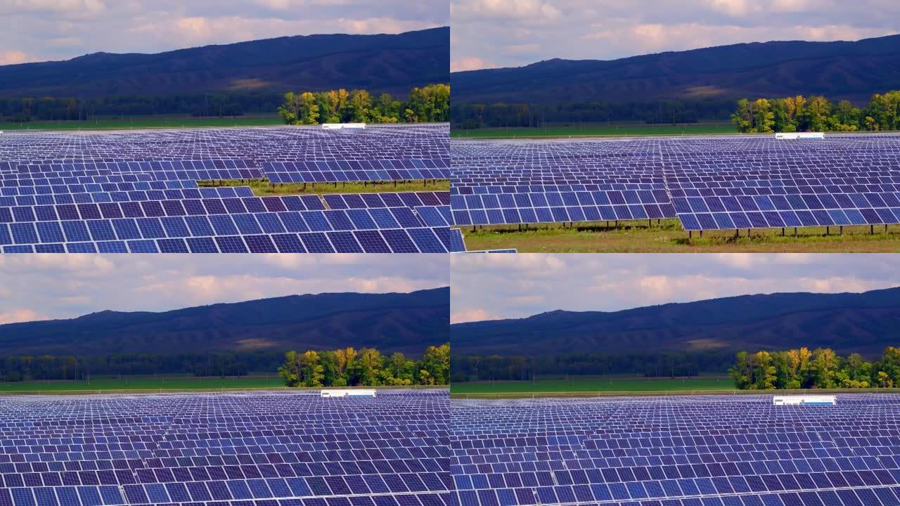 低成本高效太阳能的概念。太阳能电池板，背景中的山脉。世界能源领域替代能源的发展。