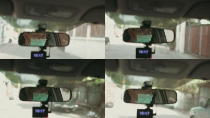 后视镜显示带防护面罩的驾驶员面部-库存视频