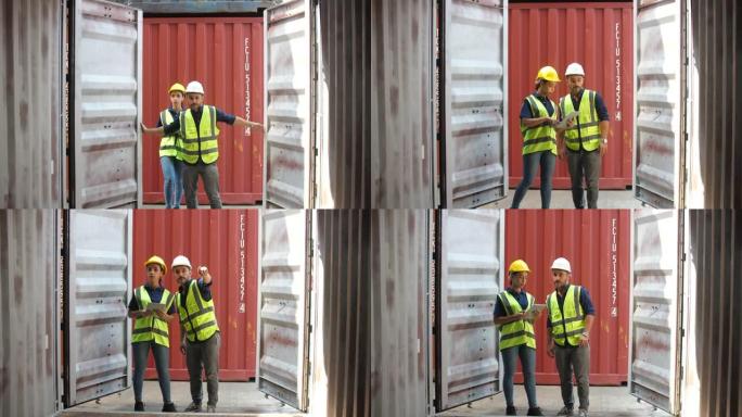 两名集装箱码头员工打开并检查集装箱货物