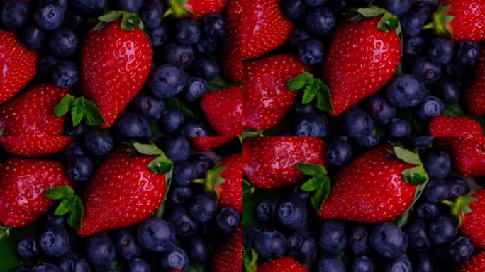 红色新鲜草莓和蓝莓的特写镜头。