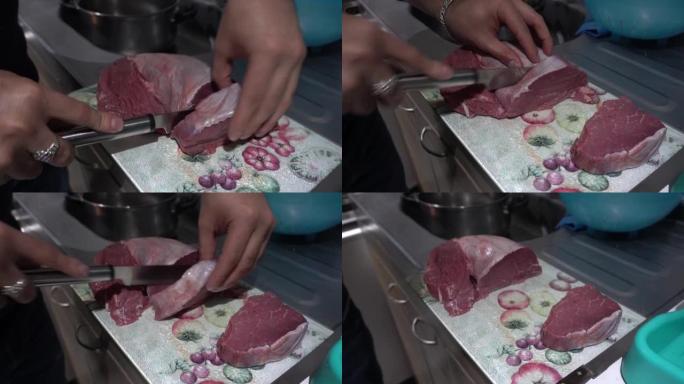 一名男子用刀割肉，用手在4k的厨房里准备烤架的特写镜头