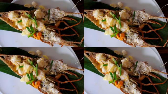 海鲜餐厅-新鲜的全红龙虾，木桌上有熟肉