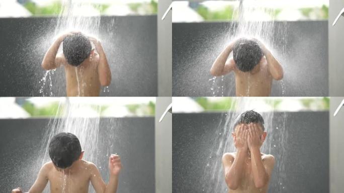 亚洲孩子在户外淋浴玩得开心。健康和幸福的概念