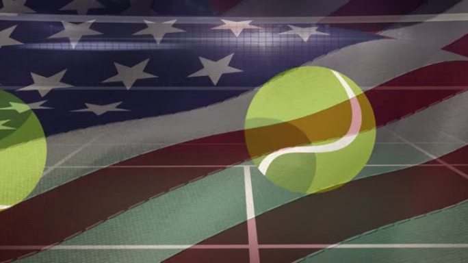 在掉落在网球场上的多个网球上挥舞着美国国旗