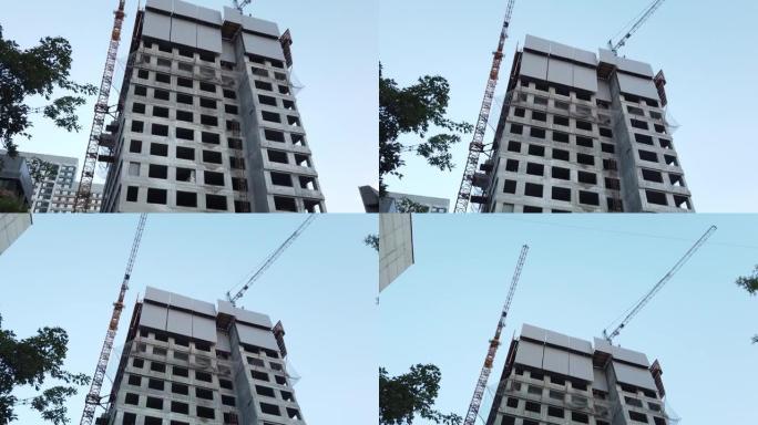 建造一栋住宅楼的高层塔楼，有建筑塔吊。