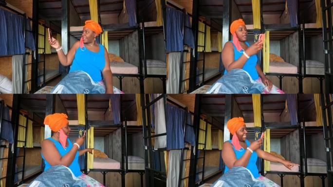 非裔美国人微笑快乐女性的4k视频在招待所房间使用智能手机在线视频通话