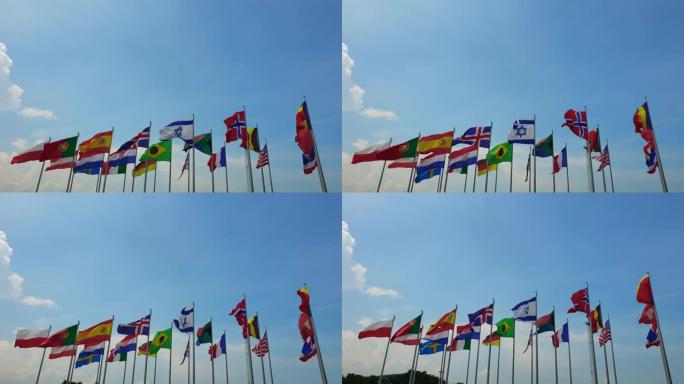 国际五彩缤纷的多面旗帜在户外的风中摇曳，抽象的世界合作共斗