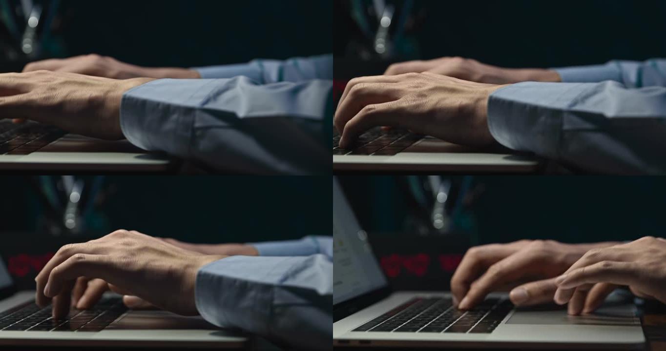 商人的手在夜间工作的笔记本电脑关键字上打字